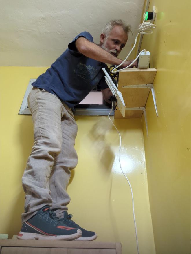 Lorenzo placing the new server in JangKom’s office